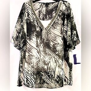 LADIES LARGE BLACK & WHITE TOP WITH A BEADED NECKLINE